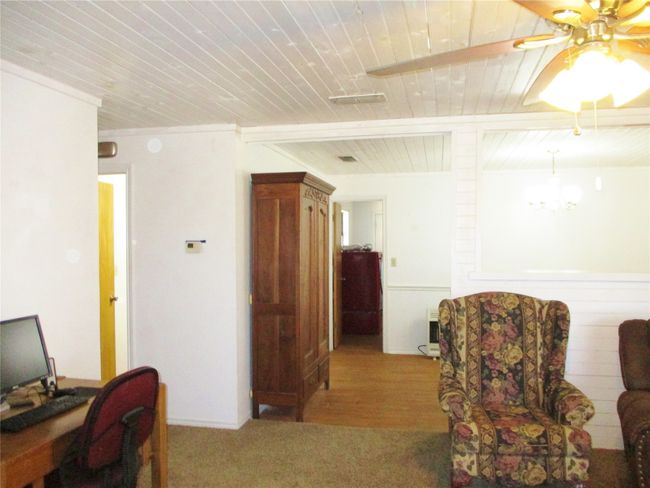 Home office featuring ceiling fan, beamed ceiling, and wooden ceiling | Image 7