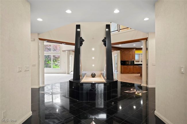 Entry featuring ornate columns, granite tiled floors, and recessed lighting | Image 5