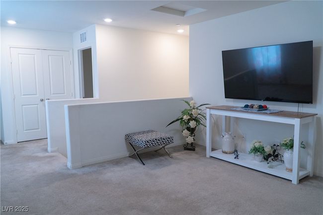 Living area featuring carpet floors, visible vents, and recessed lighting | Image 45