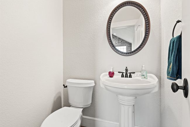 Half bath featuring toilet and a textured wall | Image 14