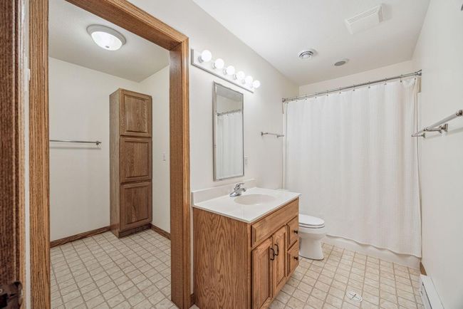 Lower level bath with dressing area to sauna. | Image 28