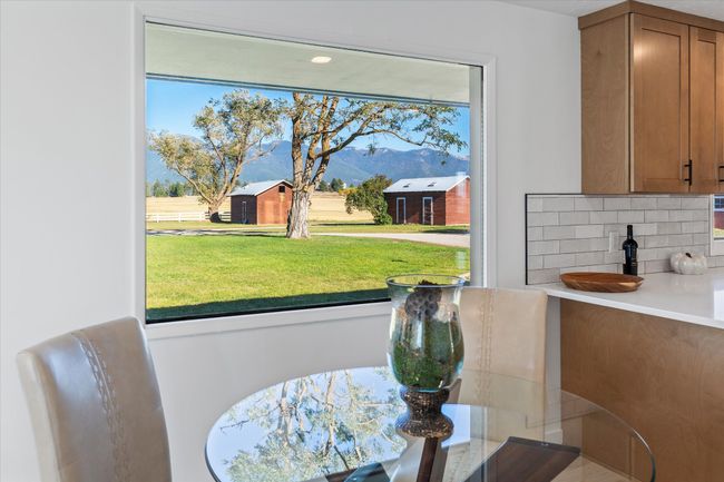 Dining area featuring a mountain view | Image 15