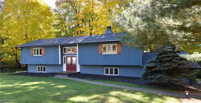 Split foyer home with a front lawn | Image 1