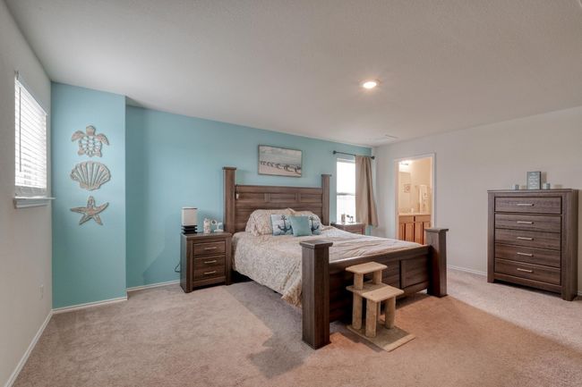 Bedroom featuring connected bathroom, light colored carpet, recessed lighting, and baseboards | Image 23