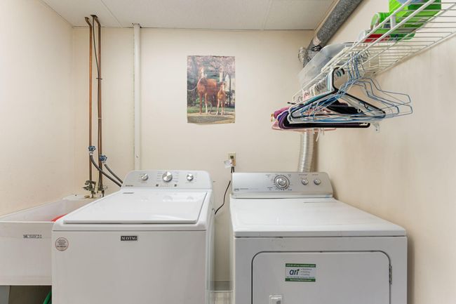 And the laundry room complete with sink and storage. | Image 30