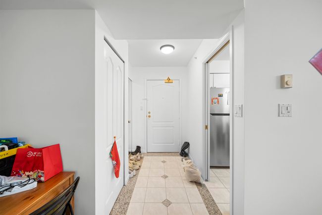 Hallway with light tile patterned floors | Image 17