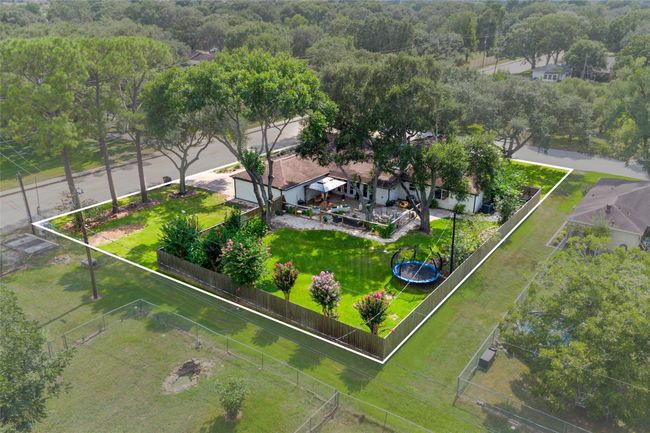 Enjoy this aerial view showcasing the backyard. | Image 21