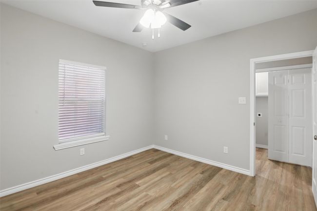 Unfurnished room featuring a ceiling fan, baseboards, and light wood-style floors | Image 21
