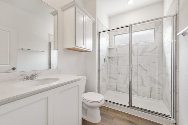 Full bath with a stall shower, vanity, and wood finished floors | Image 24