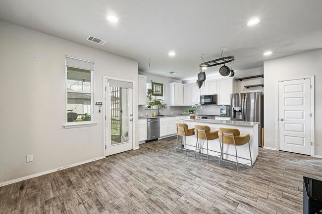 Great sized pantry with plenty of wood shelves. | Image 12