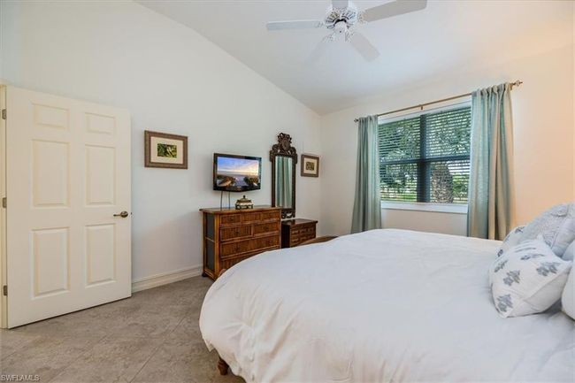 Bedroom featuring ceiling fan and vaulted ceiling | Image 13