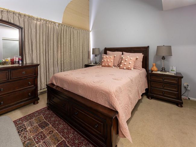 Bedroom with light colored carpet | Image 20