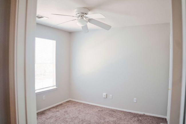 Carpeted spare room with a ceiling fan and baseboards | Image 25
