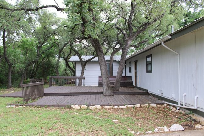View of yard featuring a wooden deck | Image 22