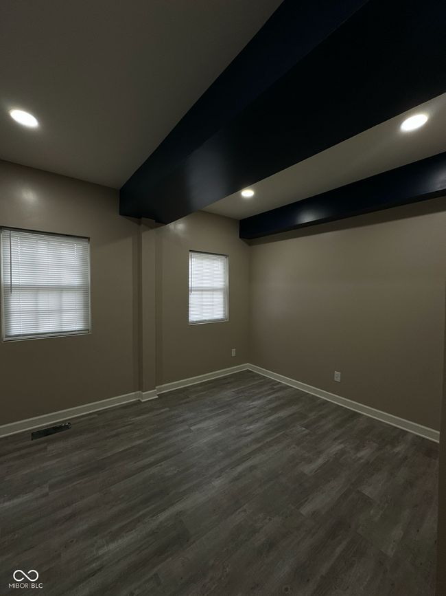 Unit 1 - Master Bedroom featuring dark wood-type flooring and recessed lighting | Image 9