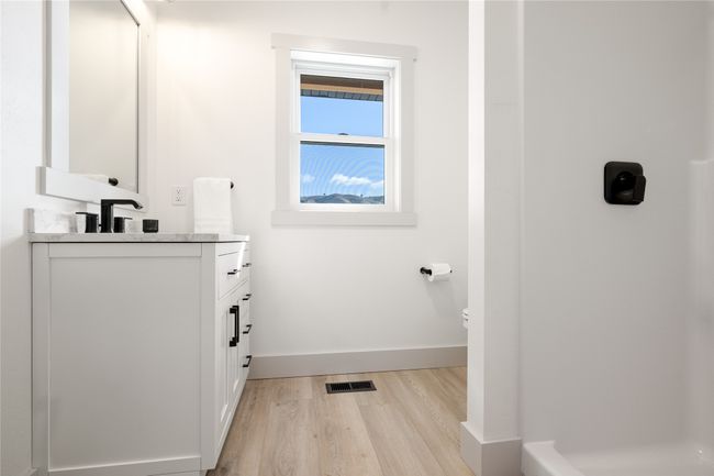 Bathroom featuring vanity and wood finished floors | Image 23