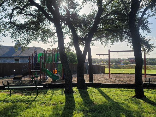 View of community park, picnic area, children's playscape and swings | Image 24