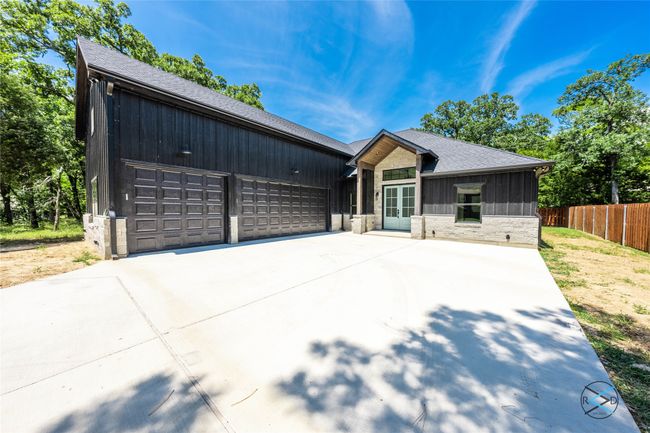 View of front of house featuring a garage | Image 5