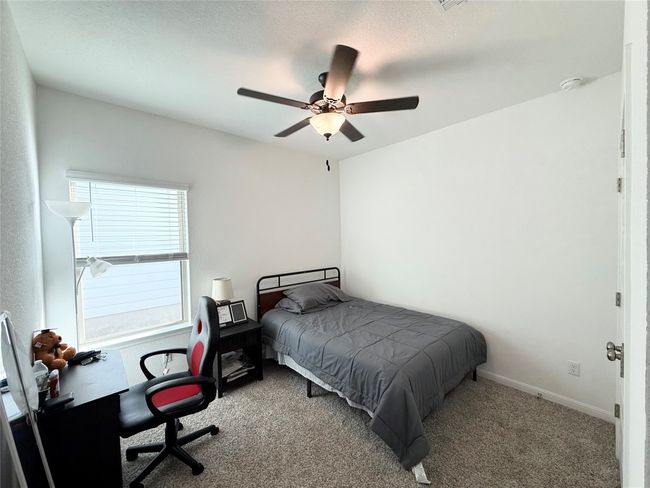 Bedroom featuring carpet flooring and ceiling fan | Image 18