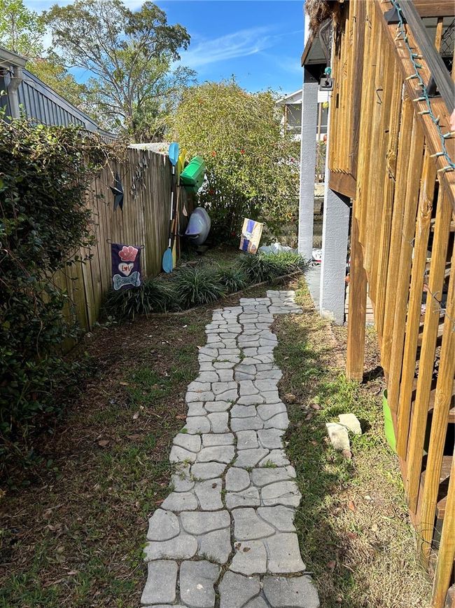 pathway from stairs to backyard | Image 21