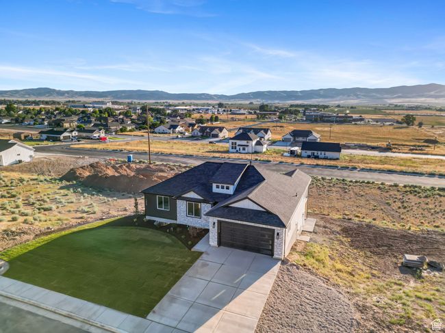 Aerial view of residential area featuring a mountainous background | Image 32
