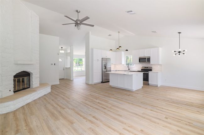 Open floorplan featuring the kitchen and living room. | Image 6