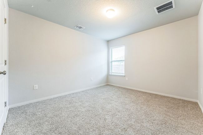 Carpeted spare room with baseboards | Image 11