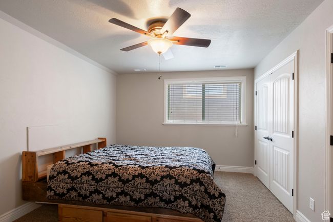 Bedroom with carpet floors and ceiling fan | Image 19