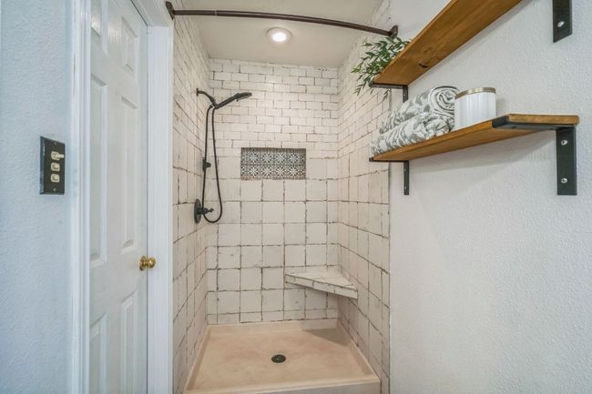 Full bathroom with a tile shower | Image 18