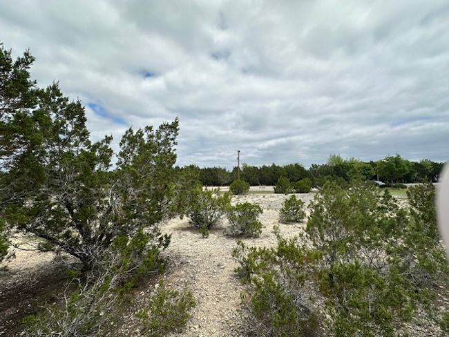 Back of lot facing toward unpaved road | Image 9