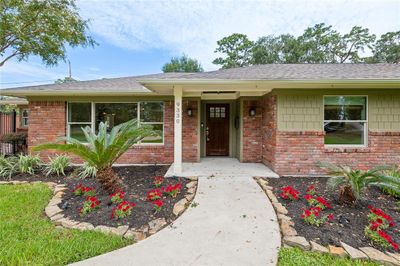 A renovated home located on a large lot with ample space for outdoor living and entertaining. You are going to love the expansive outdoor space, gorgeous landscaping, and outdoor pool. | Image 1