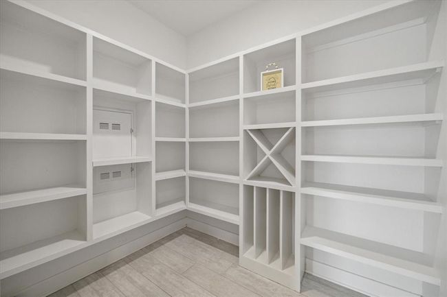 Huge walk-in pantry provides abundant storage. | Image 6