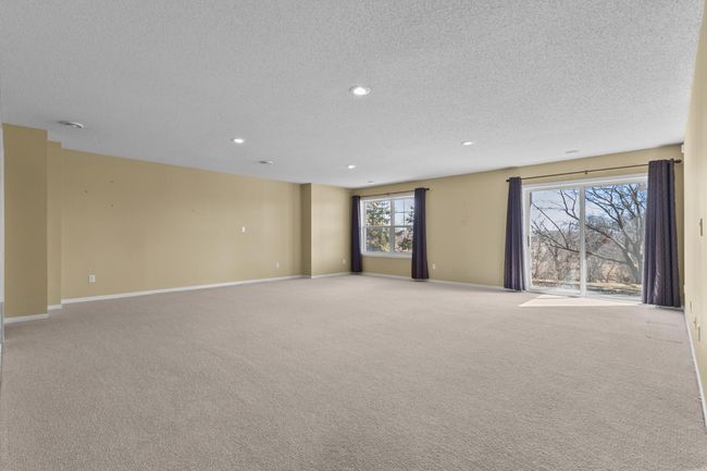 Amazing lower level family room is perfect for entertaining. Slider leads out to patio. | Image 20