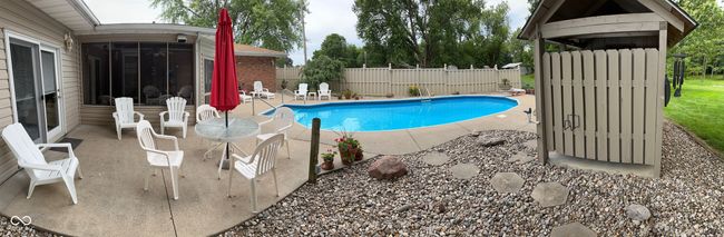 view of pool with a sunroom, a patio area, a fenced in pool, and a fenced backyard | Image 34
