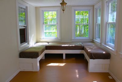 Enter unit 2 and you'll find yourself in this adorable sitting area. Next to the back door, you'll find the half bath and laundry room | Image 2