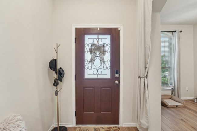 Entrance foyer featuring light wood finished floors and arched walkways | Image 4