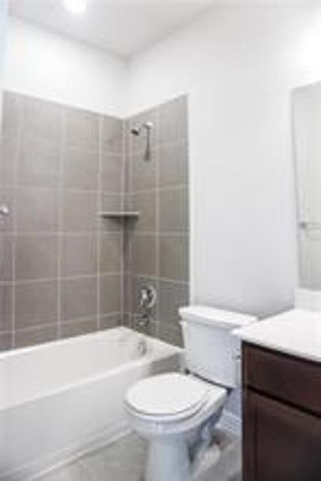 Full bath featuring vanity and shower / washtub combination | Image 15