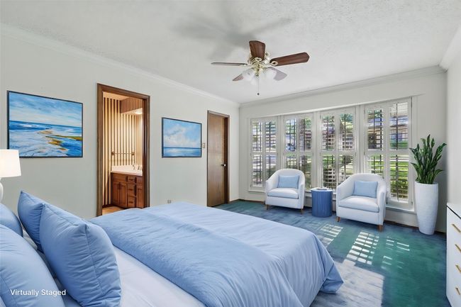 Virtually Staged Bedroom with ensuite bath, crown molding, and ceiling​​‌​​​​‌​​‌‌​‌‌​​​‌‌​​‌‌​‌​​​​​‌ fan | Image 32