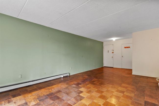 room featuring baseboard heating and a textured ceiling | Image 10