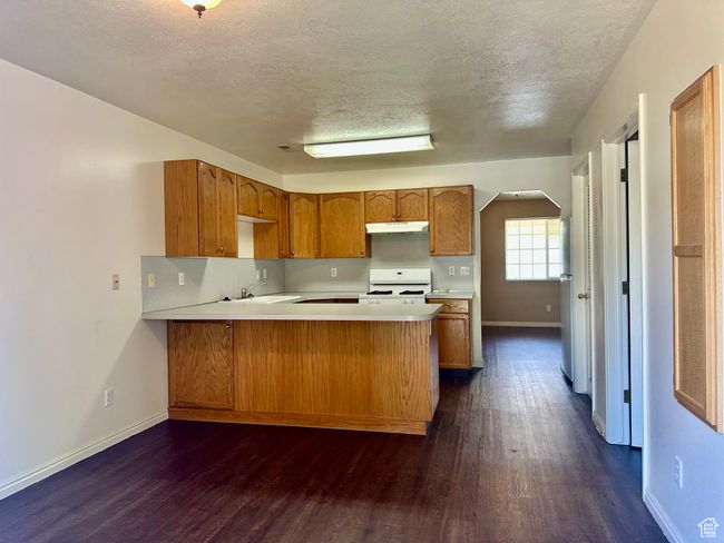 Spacious and functional kitchen with plenty of countertop space | Image 11