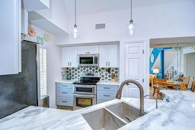 View from bar into kitchen | Image 16