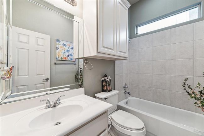 Downstairs full bath located next to the Sunroom/2nd Bedroom. There is also a powder bath downstairs so this doesn't need to be shared with guests. | Image 15