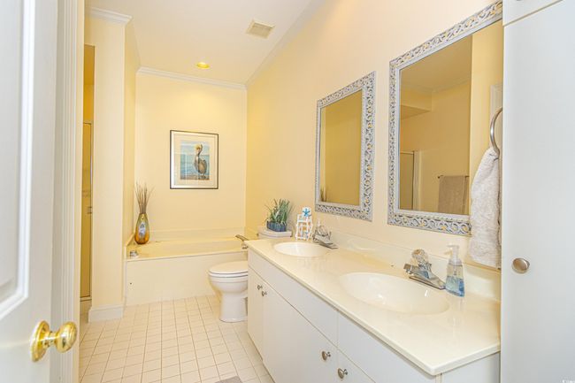 Full bath with visible vents, a sink, tile patterned flooring, and crown molding | Image 25