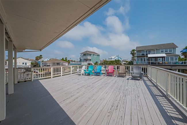 Large wooden deck offers a clear view of this coastal paradise. | Image 21