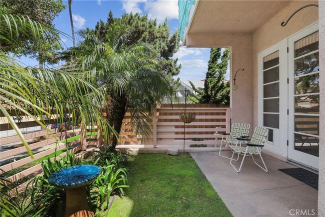 Lovely and lush patio/grassy area just outside your living space! | Image 9
