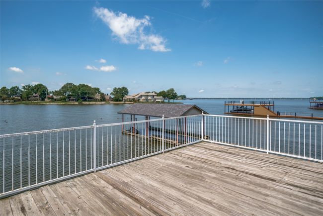 Deck featuring water view and a dock | Image 26