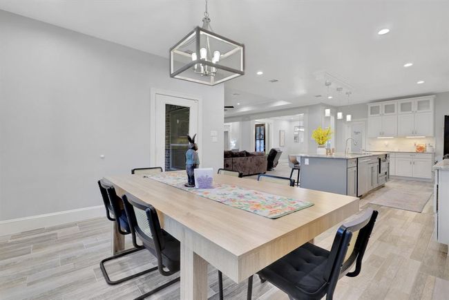 Enjoy serene views of the outdoors from the breakfast area, perfectly situated within the open and airy floor plan | Image 21