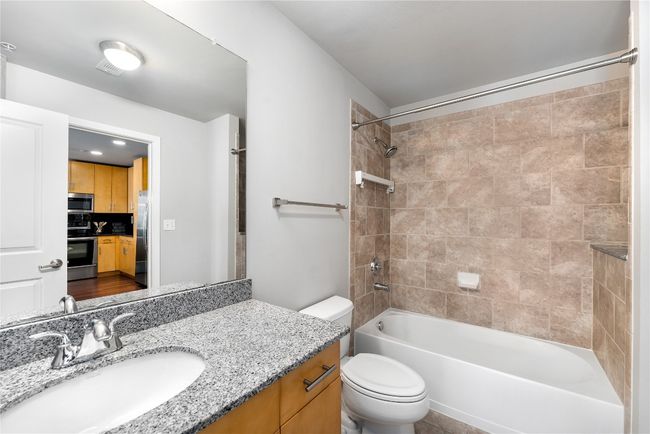 Bathroom with vanity and washtub / shower combination | Image 13