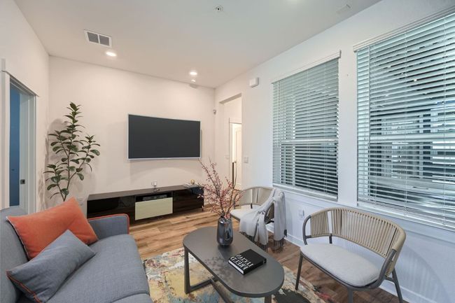 Living room featuring visible vents, wood finished floors, and recessed lighting | Image 4