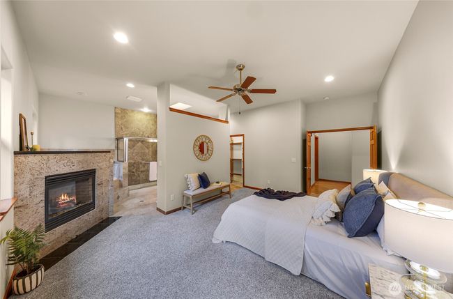 Double door entry and fireplace in the primary en-suite | Image 17